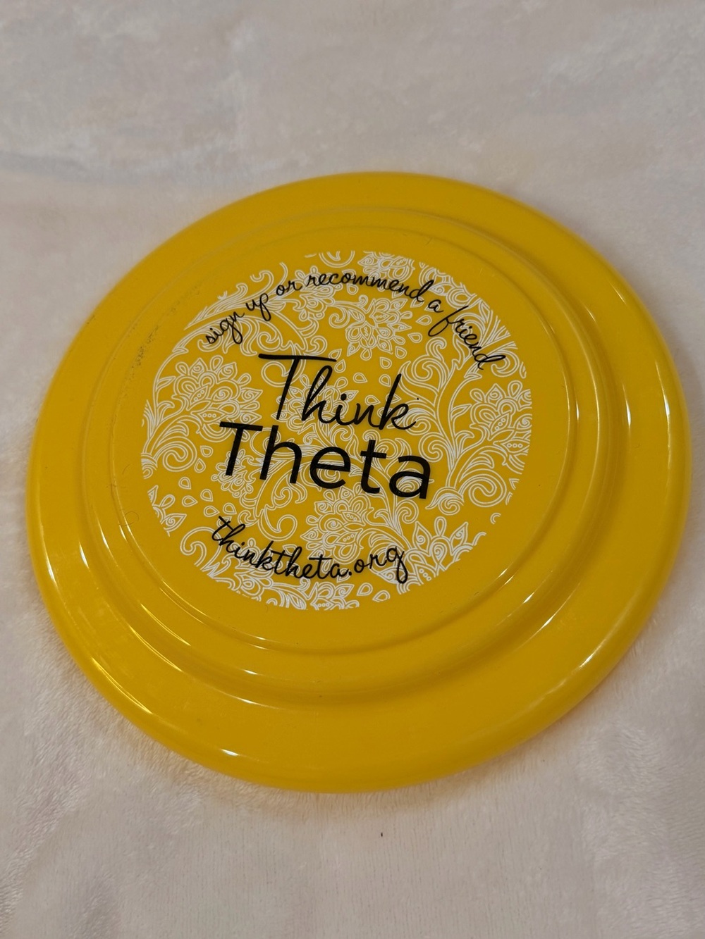 Yellow Decorative Frisbee - ThinkTheta Logo